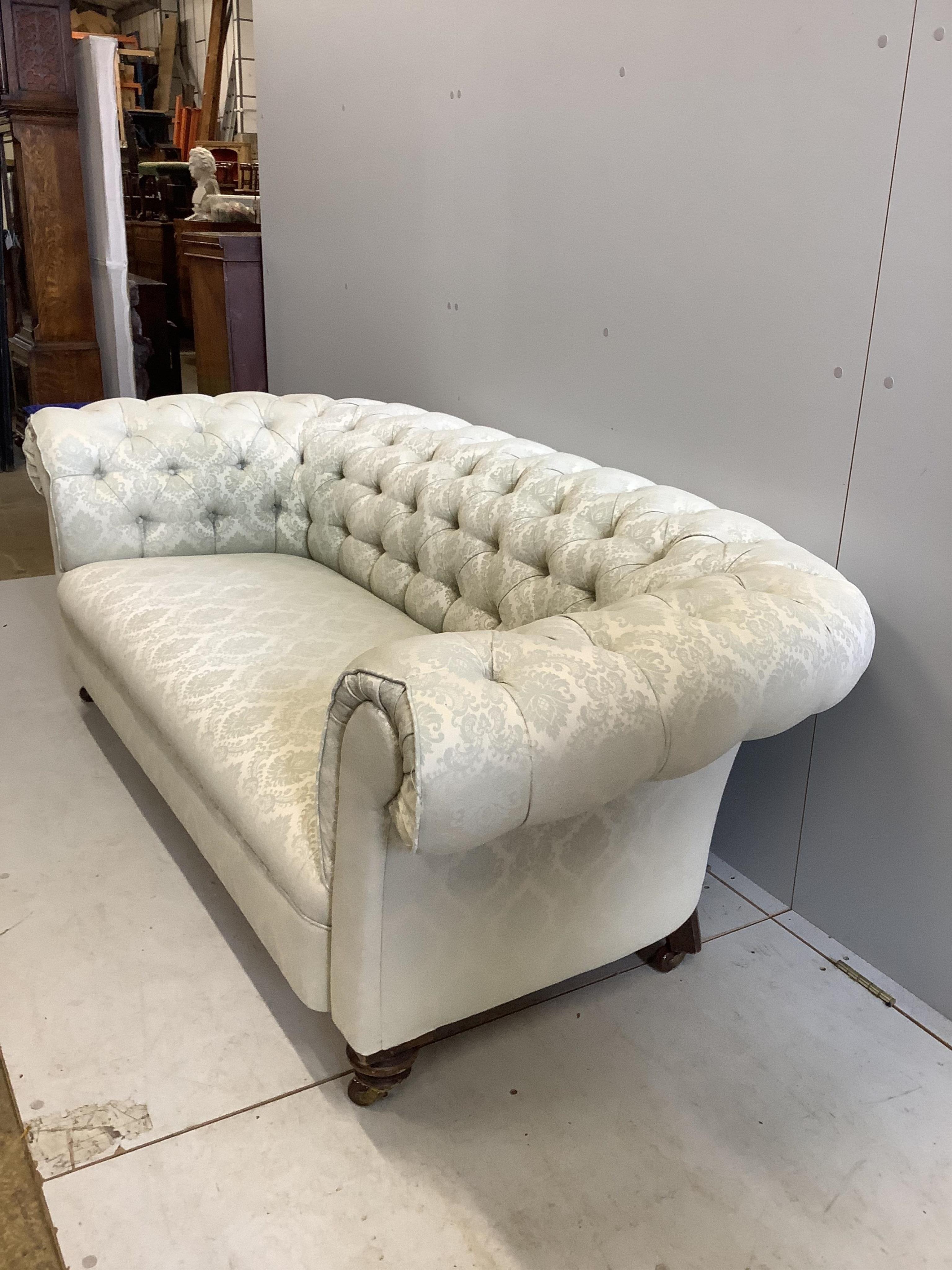 A late Victorian upholstered Chesterfield settee, width 190cm, depth 86cm, height 66cm. Condition - fair